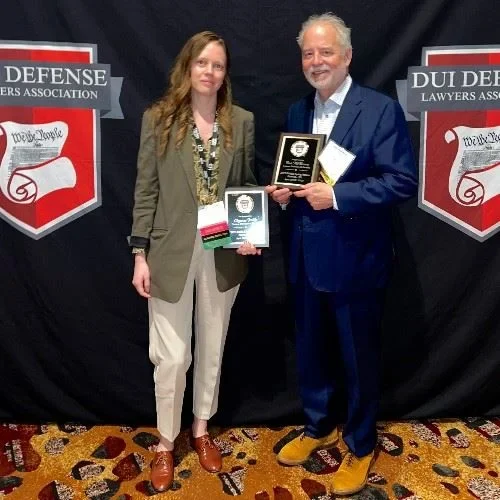 Shyanne Riddle receiving recognition alongside Rob McKinney at the DUI Defense Lawyers Association conference